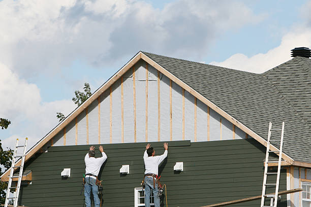 Professional Storm Damage Siding Repair technician working in Newtown, PA
